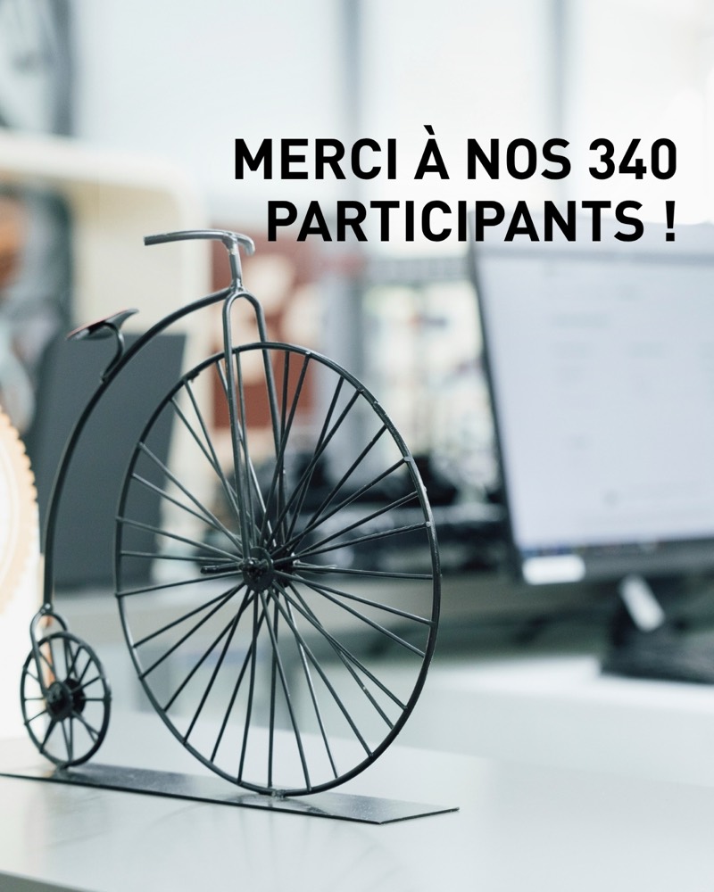 Bild 2 von 5: «Merci à nos 340 participants !» – danke an die 340 Teilnehmenden. Ein Hochrad-Modell auf der Theke.